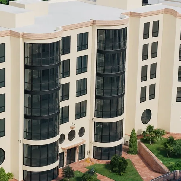 The curved glass facade of Douerta Residences in Kaminia
