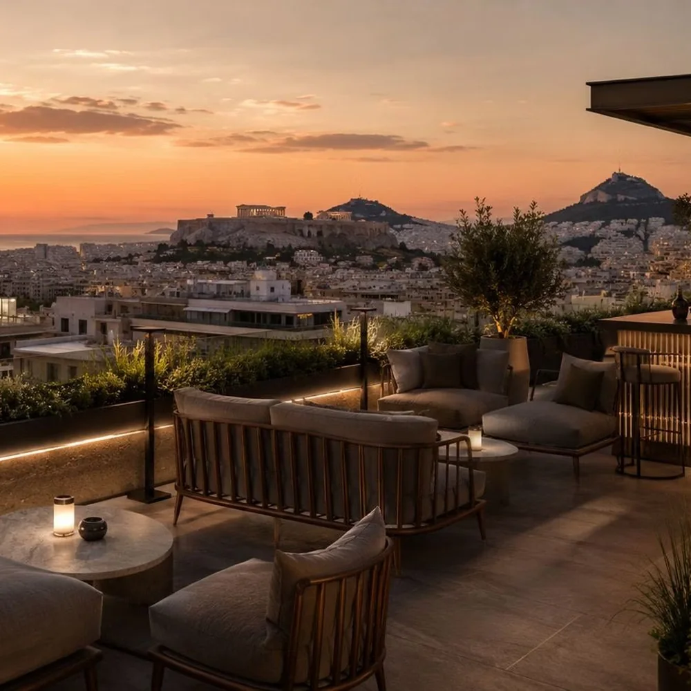 The rooftop bar of Ramada Residences at sunset, the Acropolis beyond
